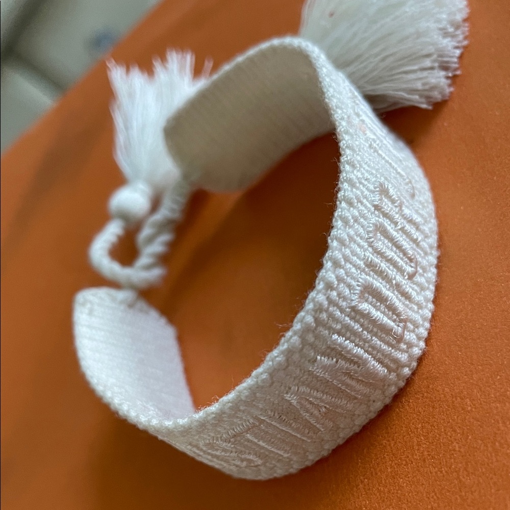AUTHENTIC Dior White Textured Bracelet with Tassels